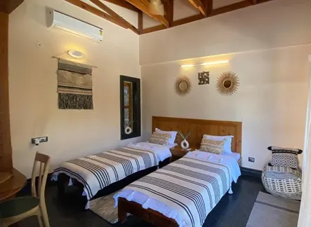 Comfortable Twin Shared Room Spacious twin shared room with modern amenities at Rishikesh Yogpeeth